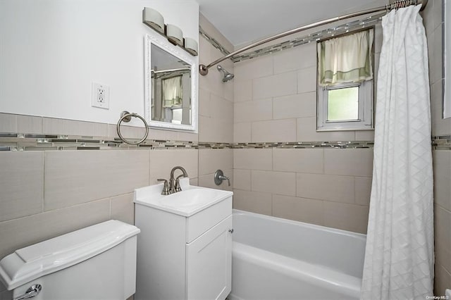 full bath with toilet, shower / bathtub combination with curtain, tile walls, and vanity