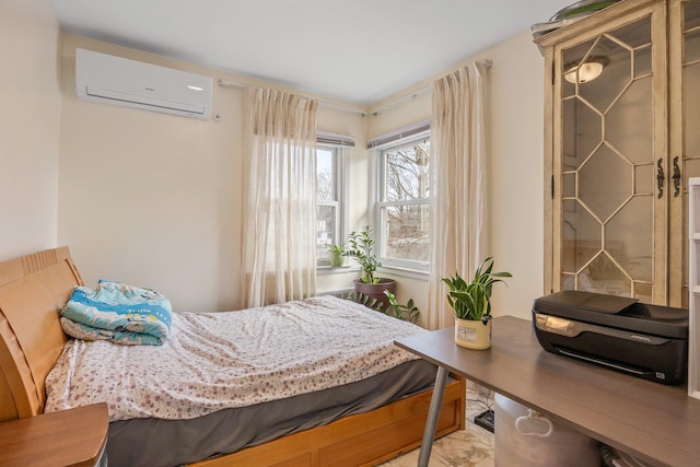 bedroom featuring a wall unit AC