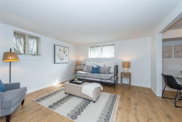 bedroom featuring baseboards and wood finished floors