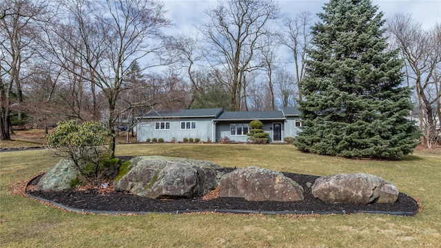 view of front of home featuring a front lawn and board and batten siding