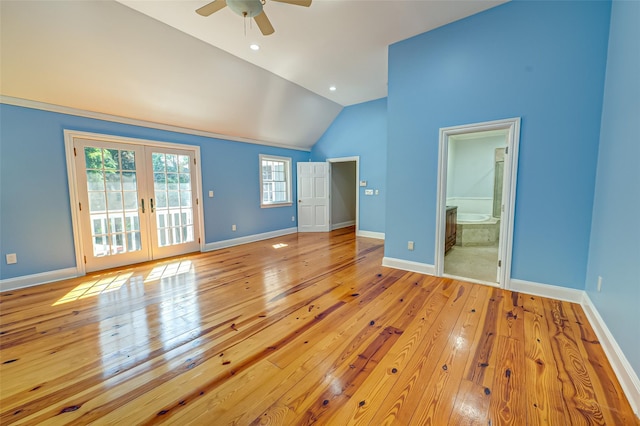 interior space featuring lofted ceiling, baseboards, access to exterior, french doors, and wood-type flooring