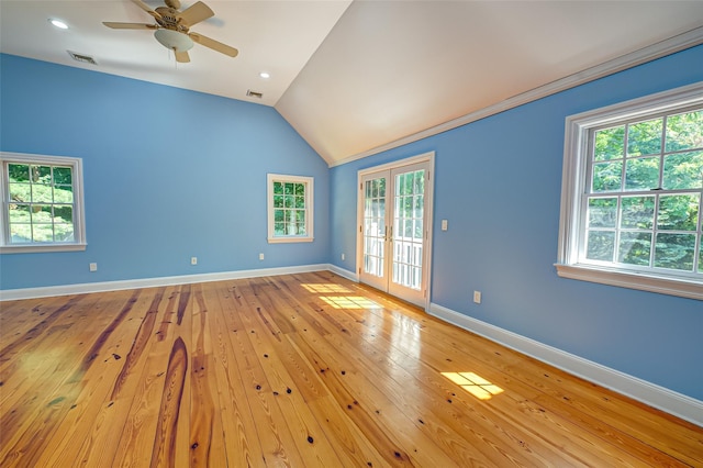 unfurnished room with plenty of natural light, french doors, visible vents, and vaulted ceiling