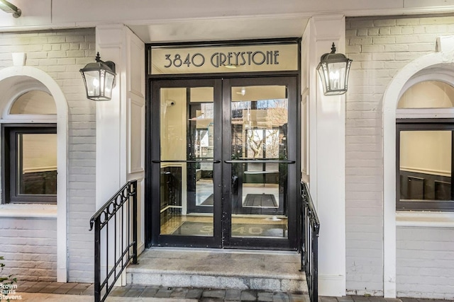 view of exterior entry featuring french doors