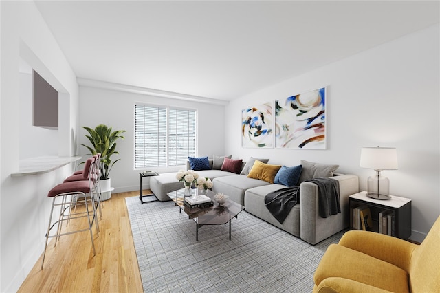 living room with light wood-style flooring and baseboards