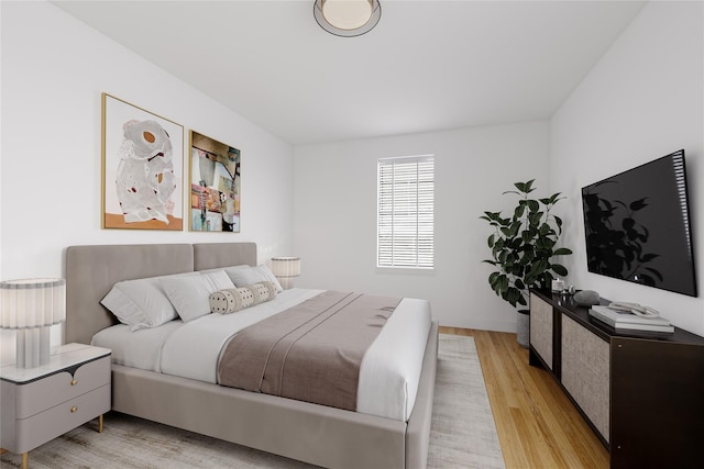 bedroom featuring light wood-style flooring