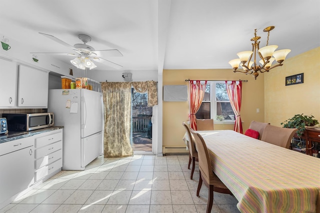 dining area featuring light tile patterned floors, ceiling fan with notable chandelier, and a baseboard radiator