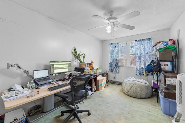 carpeted office featuring a ceiling fan, a textured ceiling, and baseboard heating