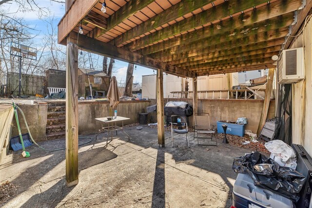 view of patio featuring fence and area for grilling