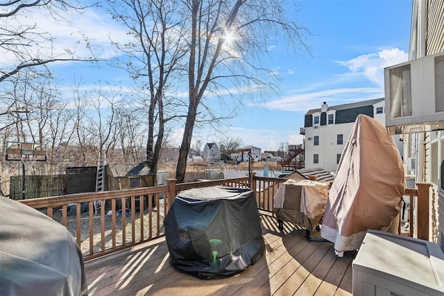 3296 Griswold Ave, Bronx, NY 10465 - wooden deck with a grill and a residential view