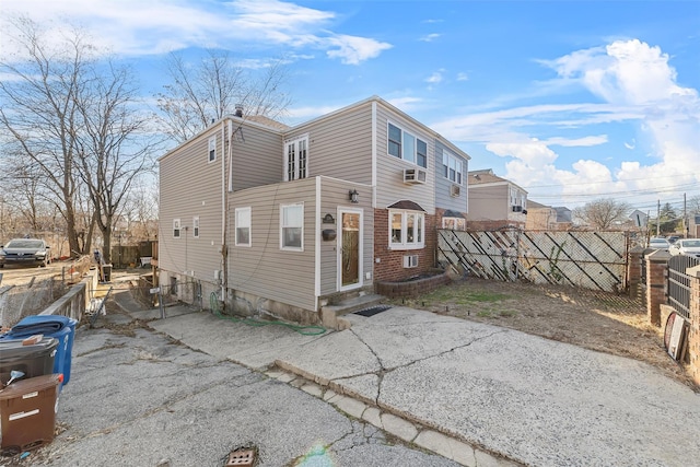 3296 Griswold Ave, Bronx, NY 10465 - view of front of home with fence, entry steps, and cooling unit