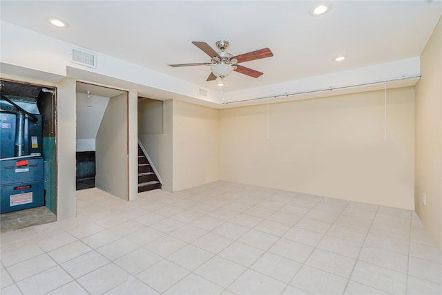 finished basement featuring a ceiling fan, stairway, recessed lighting, and visible vents