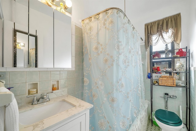 bathroom with decorative backsplash, vanity, tile walls, and a shower with shower curtain