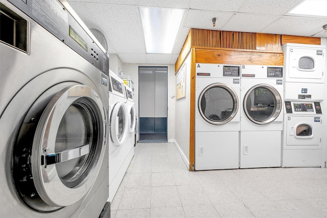 shared laundry area with washer and dryer and stacked washer / drying machine