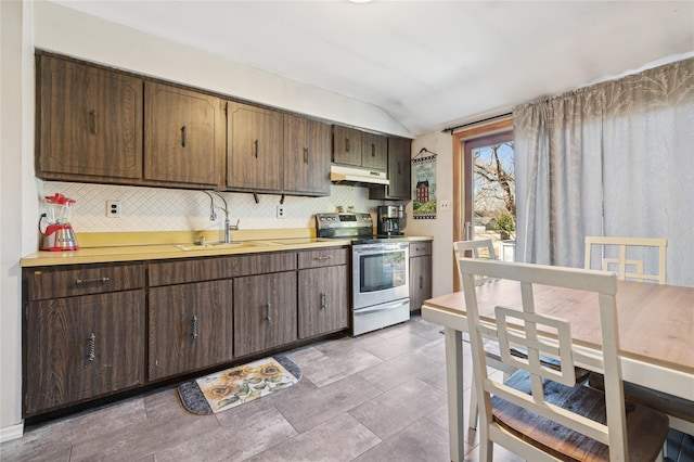 kitchen with light countertops, stainless steel range with electric cooktop, under cabinet range hood, and decorative backsplash