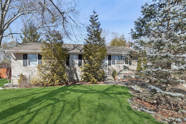 ranch-style house with a front lawn