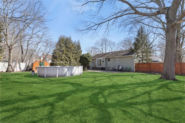 view of yard with a fenced backyard and a fenced in pool