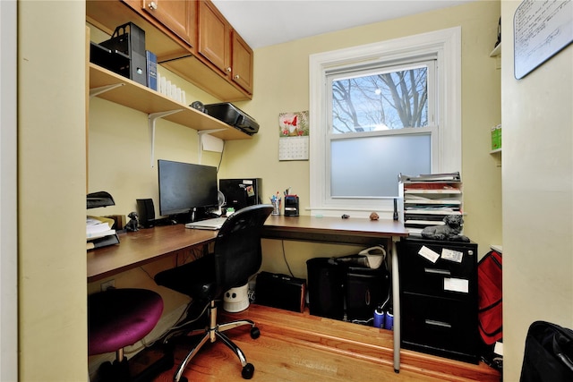 home office with wood finished floors