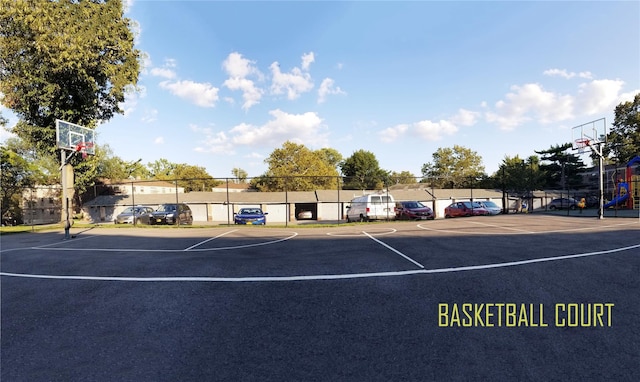 view of basketball court featuring community basketball court and fence