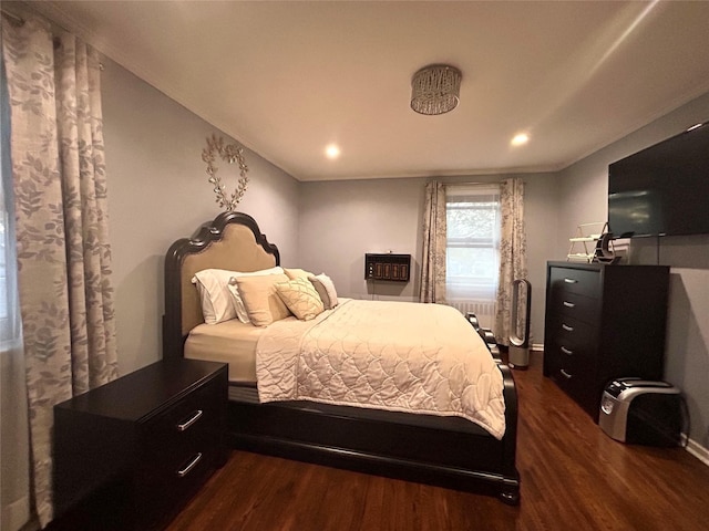 bedroom with dark wood-style floors and recessed lighting