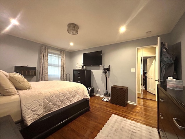 bedroom with baseboards, dark wood-type flooring, and recessed lighting