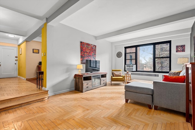 living area with radiator, beam ceiling, cooling unit, and baseboards