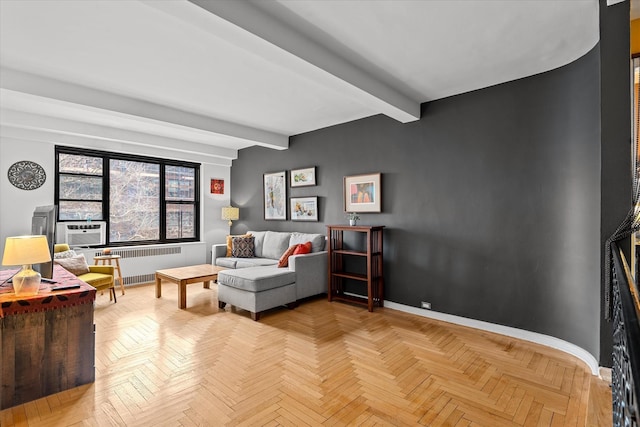 living room featuring radiator, baseboards, and beamed ceiling