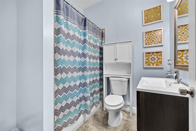 bathroom featuring vanity, toilet, and a shower with curtain