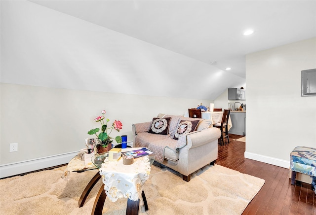 living room with lofted ceiling, hardwood / wood-style flooring, baseboards, and recessed lighting