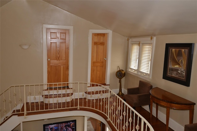 stairway with lofted ceiling