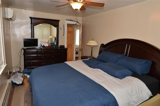 bedroom featuring a wall unit AC, ceiling fan, and baseboard heating