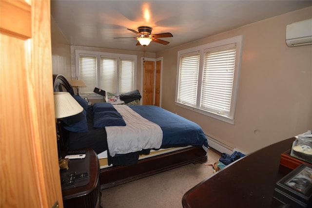 carpeted bedroom with ceiling fan, a wall mounted AC, and a baseboard radiator