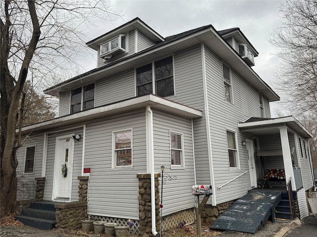 traditional style home featuring entry steps