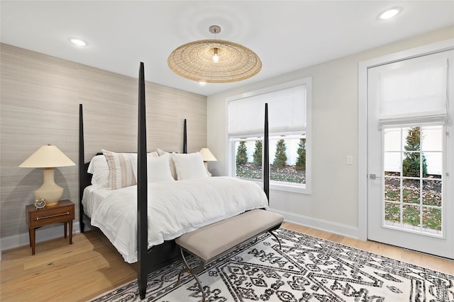 bedroom featuring light wood finished floors, recessed lighting, and baseboards