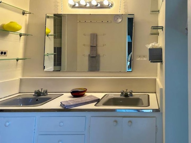 bathroom featuring double vanity and a sink