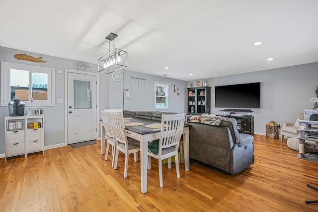 dining area with baseboards, recessed lighting, and light wood-style floors