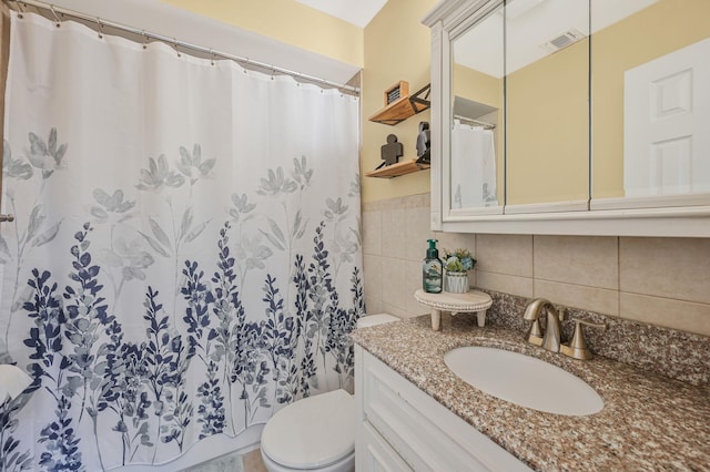 full bath with tile walls, visible vents, a shower with shower curtain, toilet, and vanity