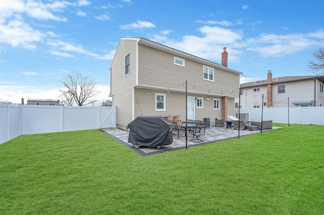 rear view of house with a patio area, a fenced backyard, a chimney, and a lawn