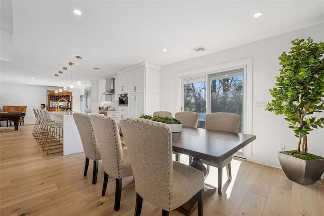 dining area featuring visible vents, recessed lighting, light wood-type flooring, and baseboards