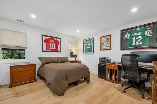 bedroom featuring recessed lighting, wood finished floors, visible vents, and baseboards