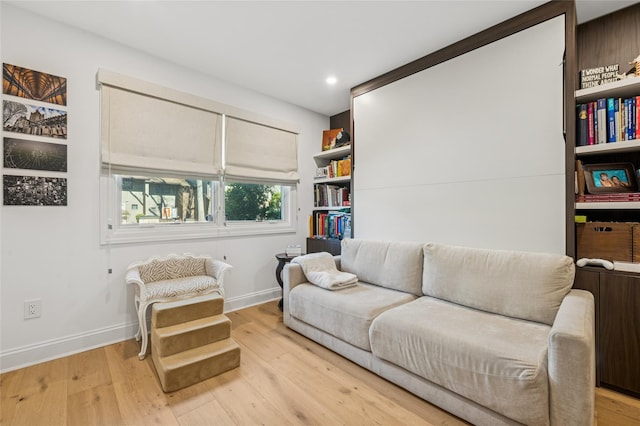 sitting room with recessed lighting, baseboards, and light wood finished floors