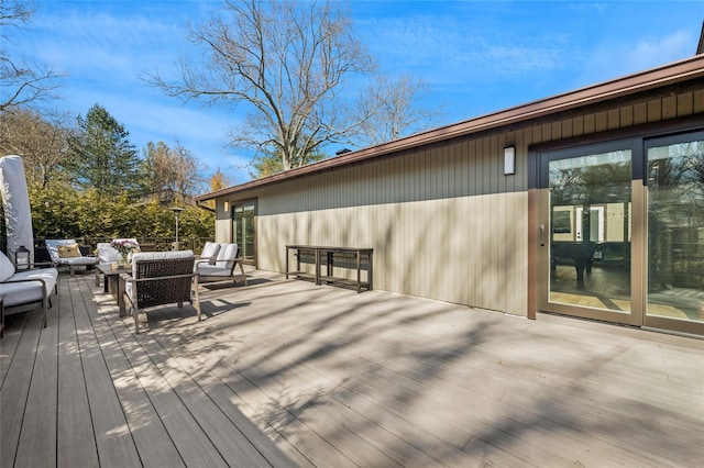 wooden terrace with outdoor lounge area