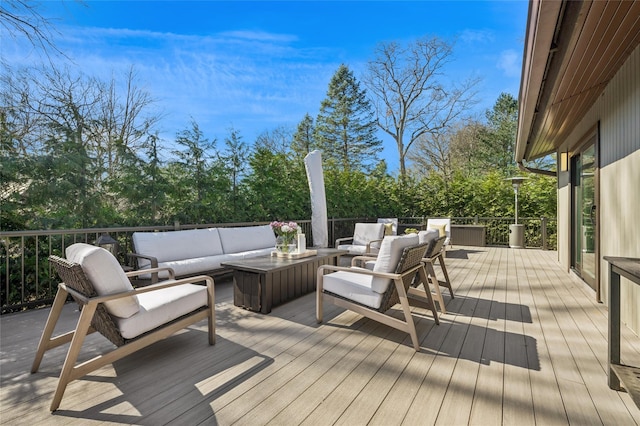 wooden terrace with an outdoor hangout area