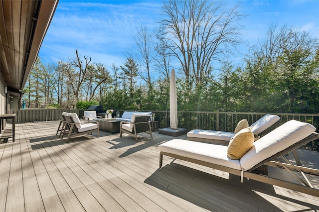 wooden deck featuring an outdoor living space