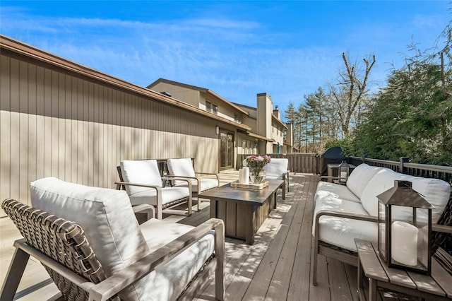 wooden deck with an outdoor hangout area