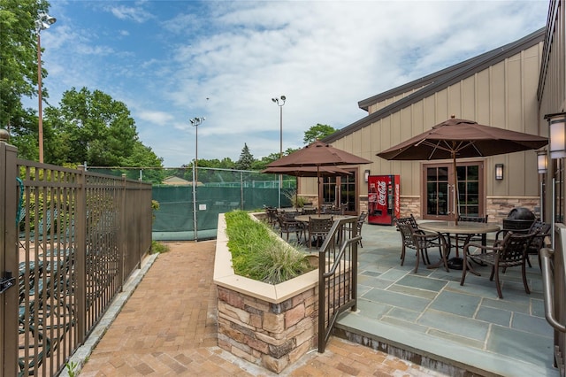 view of patio / terrace featuring outdoor dining area and fence