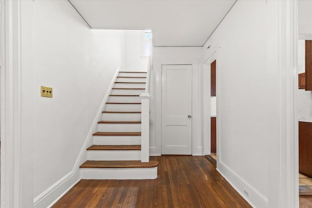 stairway featuring hardwood / wood-style floors