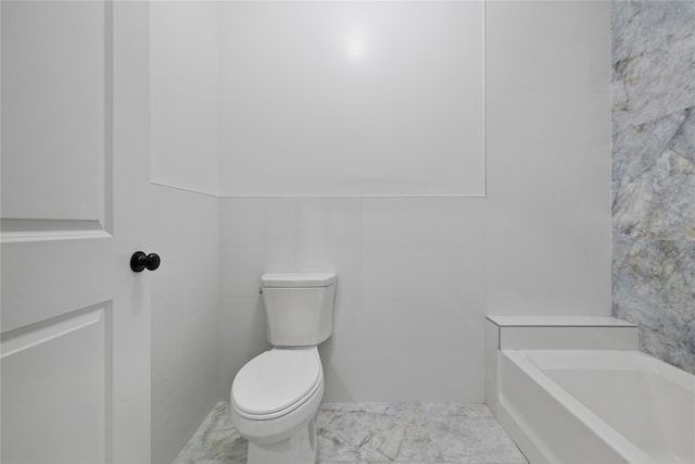 full bathroom featuring a bath, toilet, and tile walls