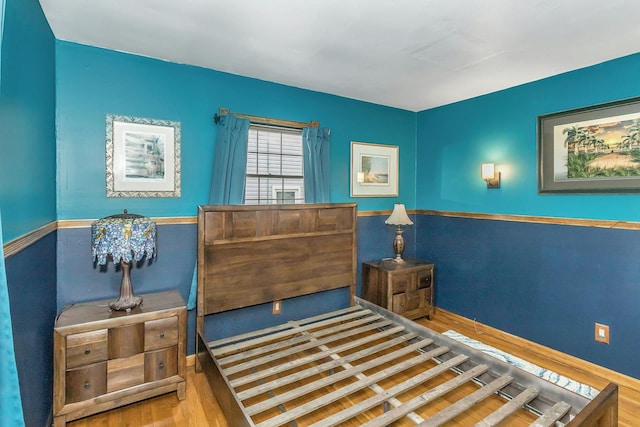 bedroom with wood finished floors