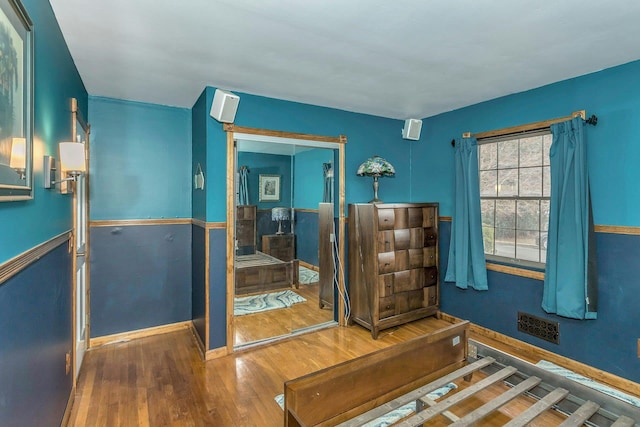 bedroom featuring wood finished floors