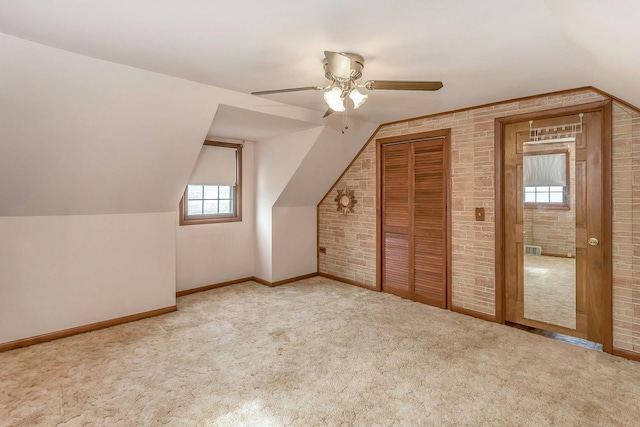 bonus room with carpet floors, visible vents, vaulted ceiling, ceiling fan, and baseboards